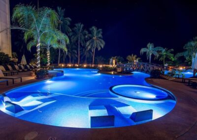 A pool lit up at night